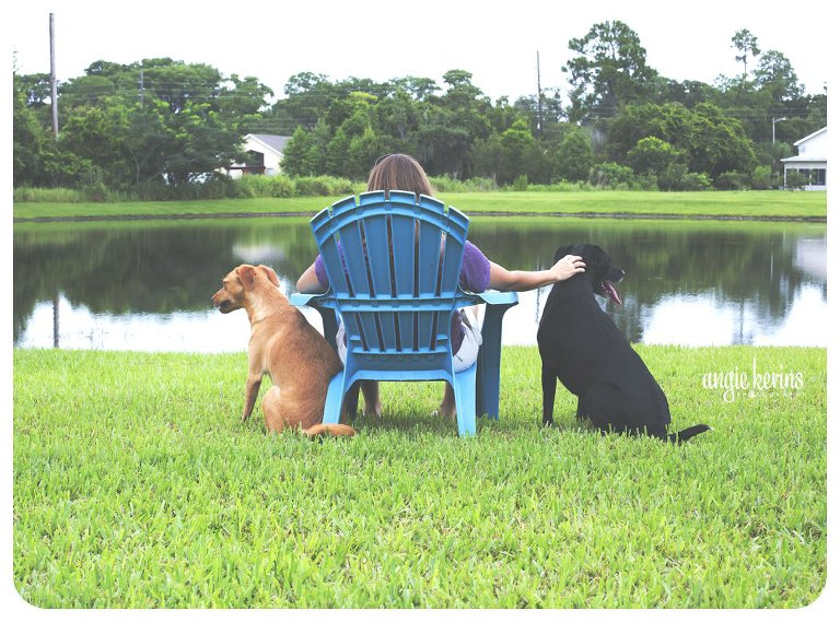 2 family dogs, relaxing on the lake with their mom